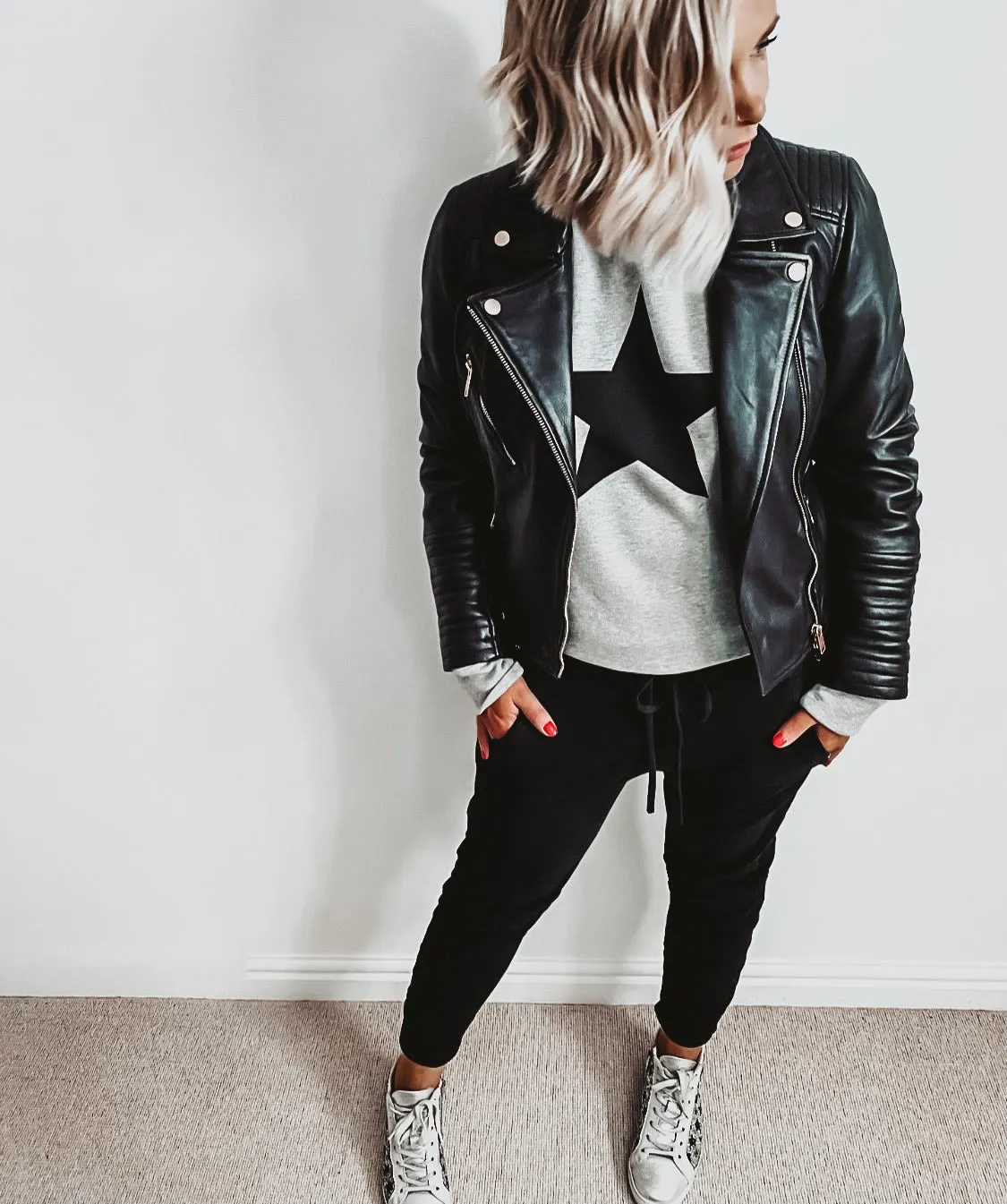 Black star on grey sweatshirt