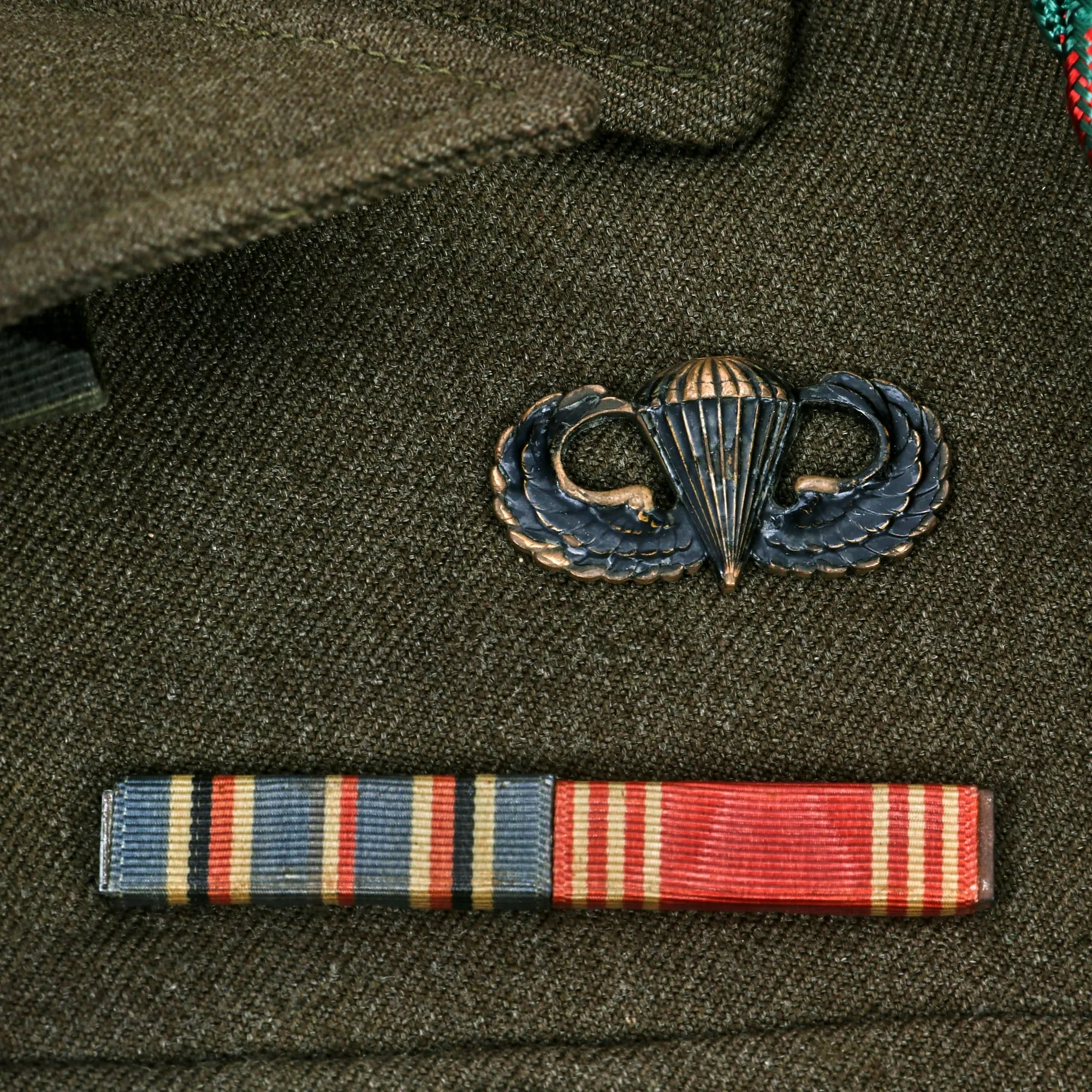 Original U.S. WWII 82nd Airborne Division, 505th Parachute Infantry Regiment Headquarters Ike Jacket Named to Private John M. Cox With Overseas Cap and Plaque